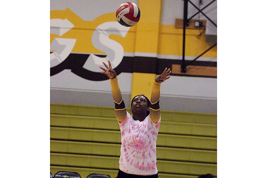 Senior Malerie Williams warms up before her last game against Chavez High School. After four years of playing volleyball, it’s time for Williams to put away her knee pads, and hang up her jersey.