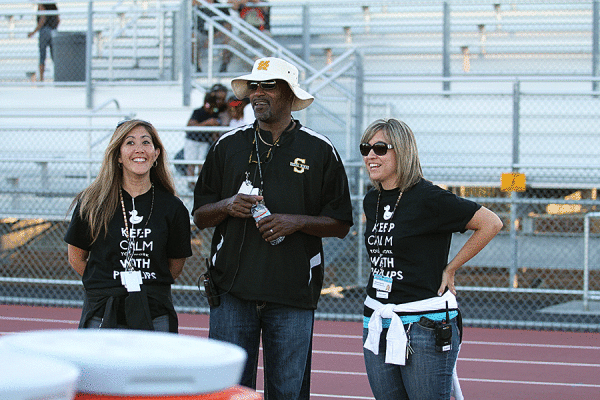 Principal Andre Phillips shares
a laugh with Roberts and Beattie as they sport their
“Keep Calm, You Work With Phillips” T-shirts.