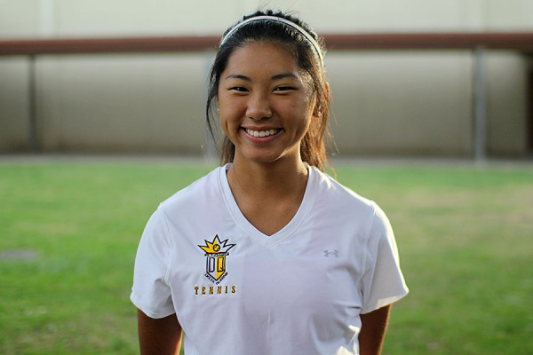 Senior Lyznie Vang poses for a picture in her uniform before a match. 