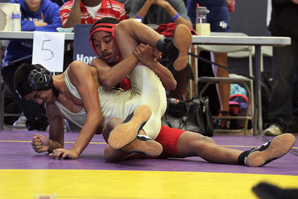Senior Alexander Rebultan struggles to get out of the hold of his opponent. 