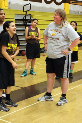 JV basketball and tennis coach Shannon Markley laughs at sophomore Leslei Lopez as she imitates her.