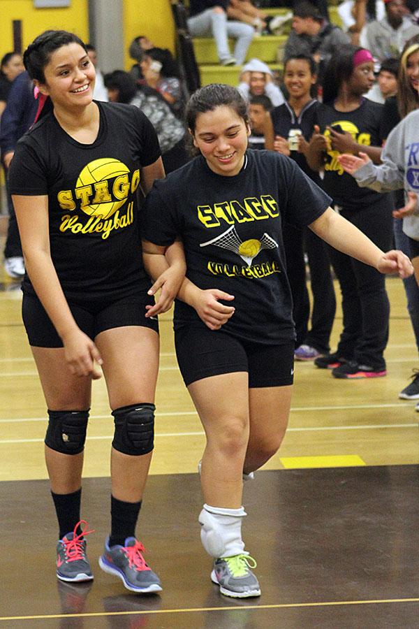 Araceli Valencia escorts her sister at her senior night, last volleyball season.  