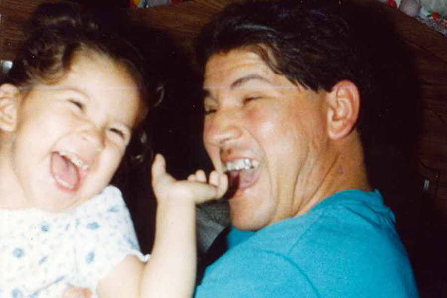 Dellanira Alcauter enjoys a cherished moment with her father at age 2.