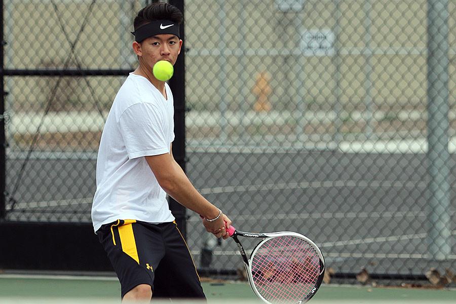 Senior Andy Hoang gets ready to hit the ball.