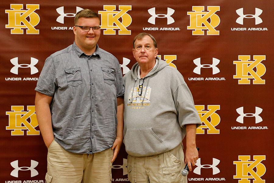 Senior Tylor Cornwell stands with football coach Don Norton after signing his letter of intent to going to Sterling University on April 3.  