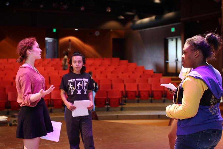 Students go into small groups to rehearse lines.
