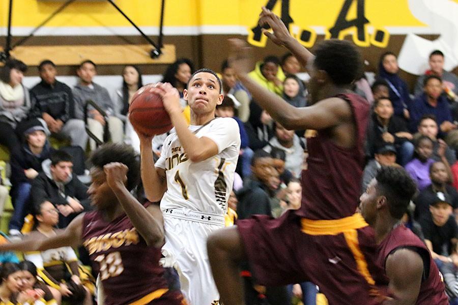 Senior Marcello Salazar goes for the layup, during the varsity game.