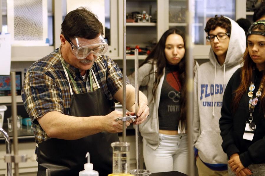 Bill Lorentz demonstrates to his students how to do the lab for that day. 
