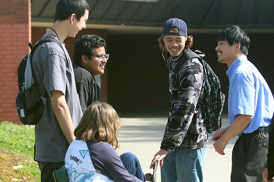 Senior Jeffery Daranikone and special ed assist Joseph Wong, along with other students from Circle of Friends, interact during their break.