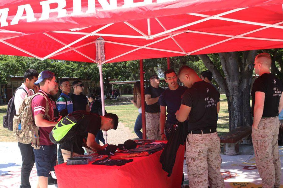 Students line up to get more information about the marines.