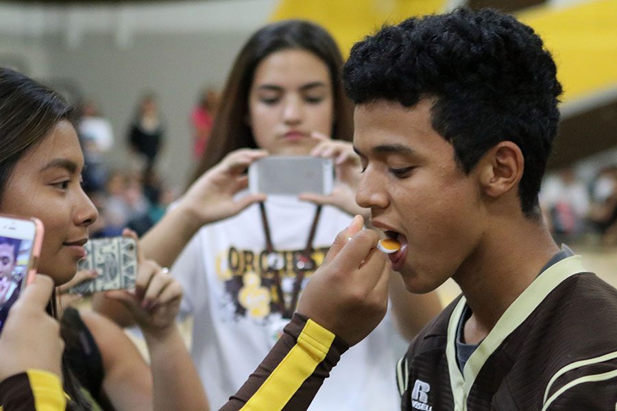 After losing musical chairs, sophomore Diego Contreras had to eat a spoonful of pumpkin, pear and corn baby food. 