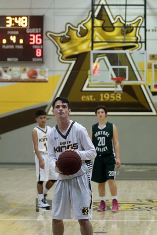 Senior Andrew Muthart, prepares to shoot a free throw during a preseason game against Central Valley High School   
