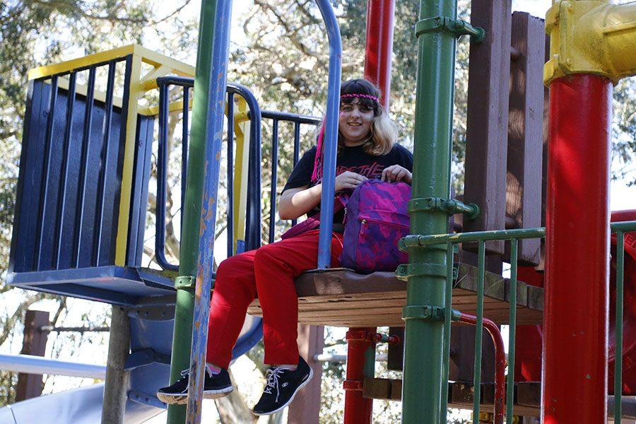 Sophomore Alustra Dominguez-Meyer sits at the playground in  Buena Vista Park. In this park, students were provided lunch by the Pride Center. 