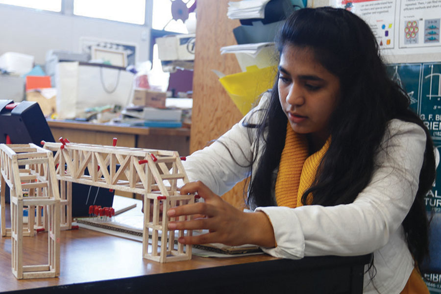 Sophomore Maha Kamran works on her bridge during MESA’s build night, where students could stay as late as 6:30 to work on their projects for that weekend’s MESA Day competition.