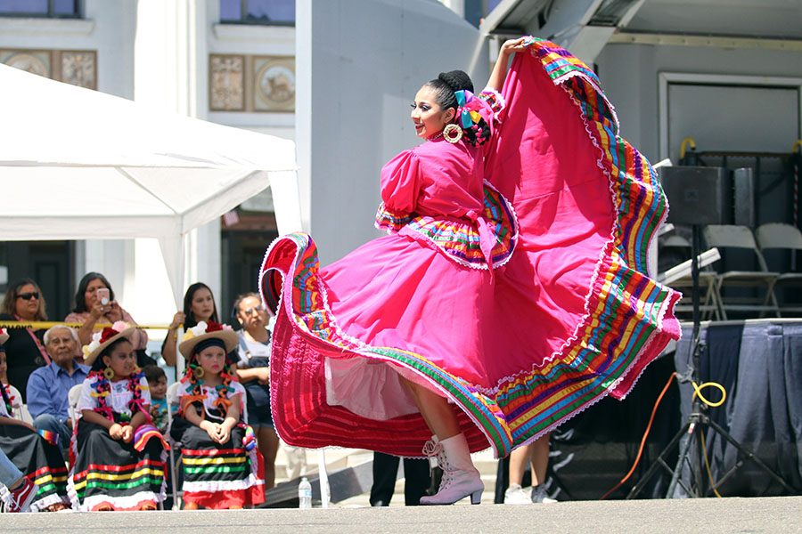 Dancer shows off her cultural attire to the audience. 