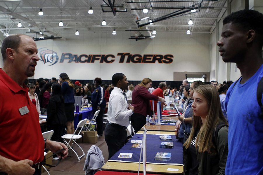 Juniors Kenyon Pierce and Krissi Doughtery talk to a representative from University of Nevada Las Vegas.