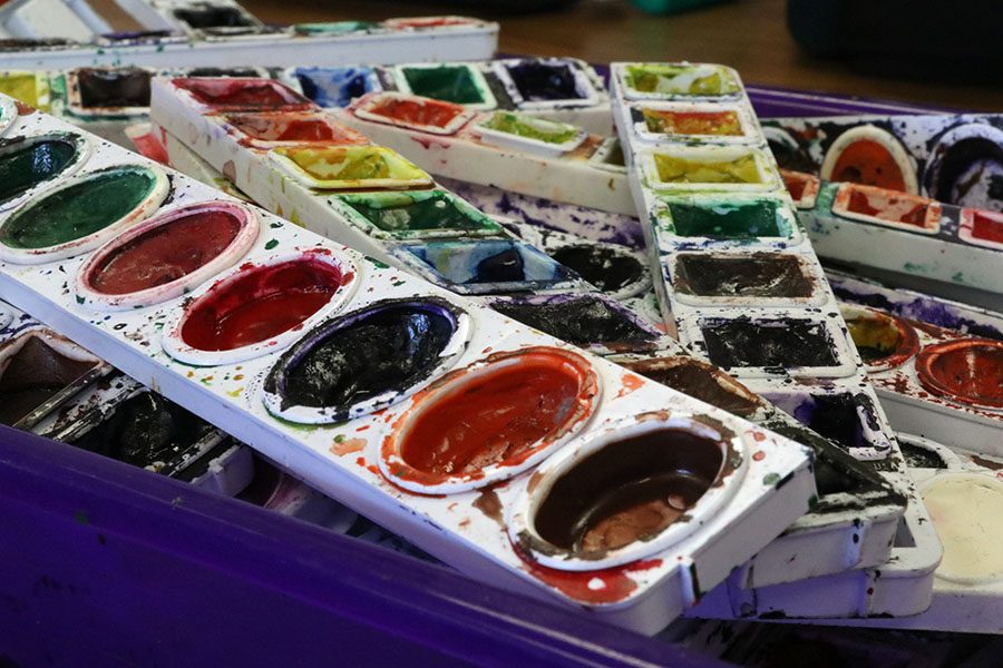 Paint pallets used daily by students in art class.
