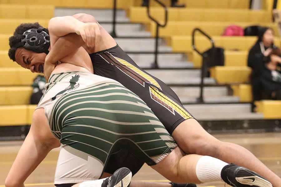 Senior Andrew Tobler engages with the other competitor. To try and get a take down. He then goes on to win the match.