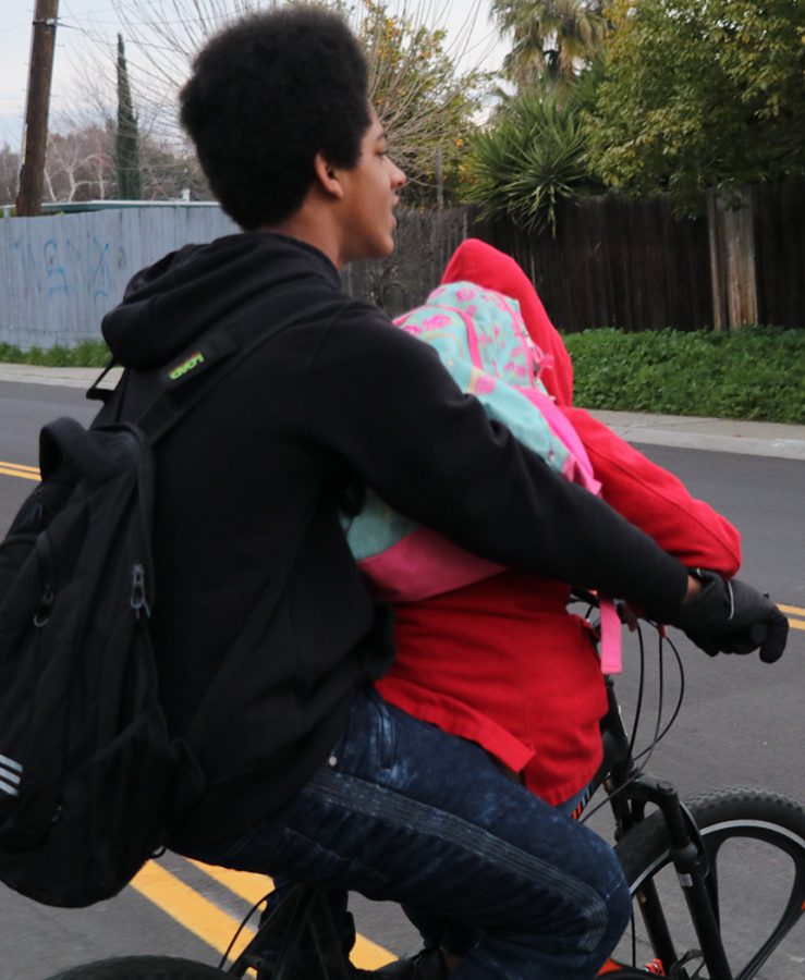 Freshman Elijah Ali drops his little cousin off every morning at Tyler Skills Elementary before going to Stagg. His cousin needs to sit on the handle bars of the bike in order to have room for both of them.