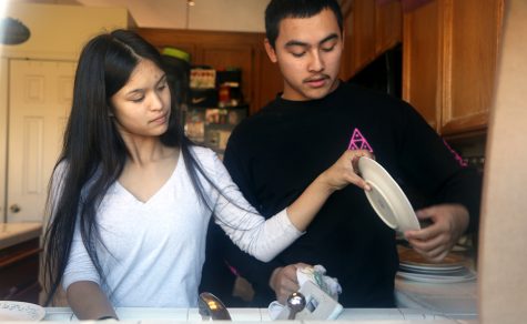 Seniors Mariele Jones and Marcelo Sarcos contribute to their home by cleaning, washing dishes, and helping around. They figure that if they split the work they could have more free time to do other things such as watching movies or playing video games.