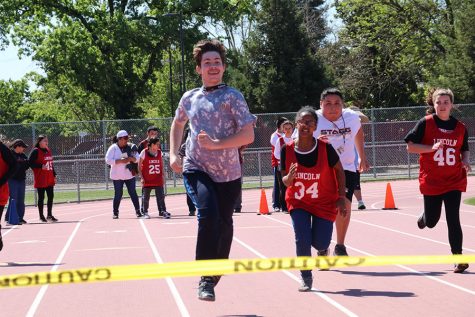 Special needs students from multiple schools came to Stagg to participate in the Special Olympics held on April 12. A student from Stagg is in the lead while the others attempt to  catch up. 