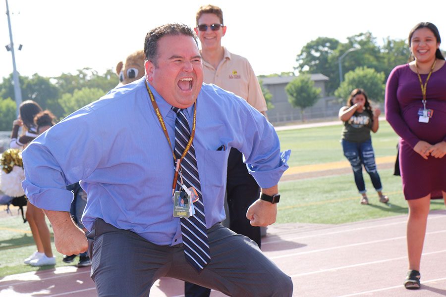 Principle Gary Phillips shows expression during his dance off against the other teachers.