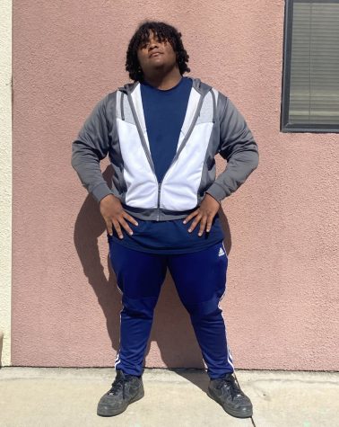 Sam Hinojosa posing in front of his school, Pacific Law Academy(PLA). Cole Goodwin/StaggOnline