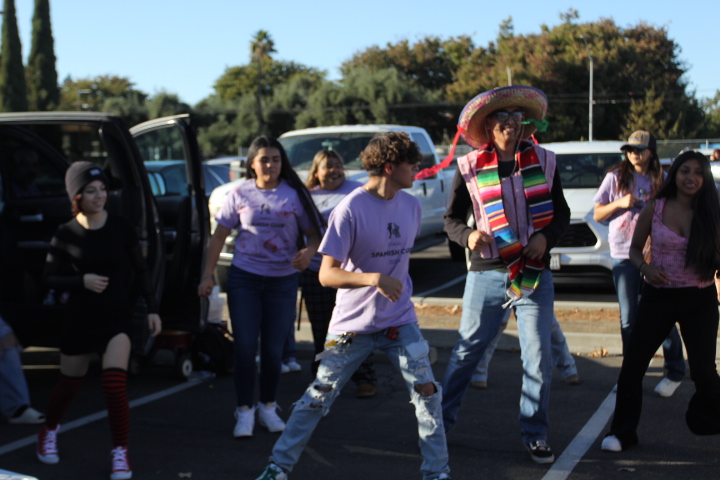 Spanish club bringing students together by dancing and enjoying their time at the trunk or treat.