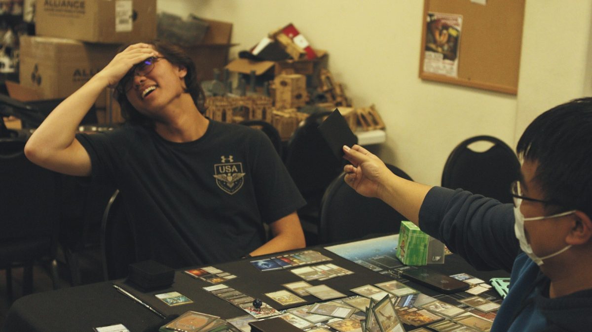 Mauntag (on right) shows Aisea (on the left ) a card that could turn the game in his favor. Aisea facial expressions shows how devastating the cards is effect. (Manny Osorio / Stagg Online)