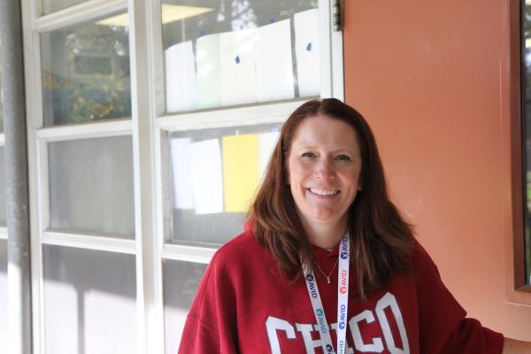 Longtime educator Tara Hayes smiles in front of her classroom door. She will embark on her journey as a new assistant principal at Hamilton Elementary. 