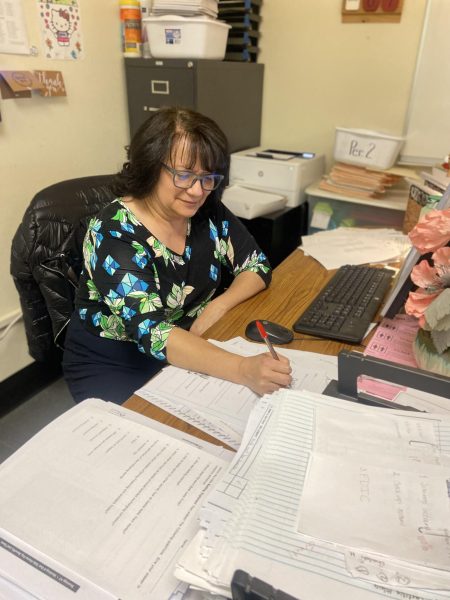 (Sylvia Paredes sitting in her classroom grading papers on Wednesday, Dec 13. She acknowledged the need for a slower math curriculum. /Ryan Turner. Stagg Online)