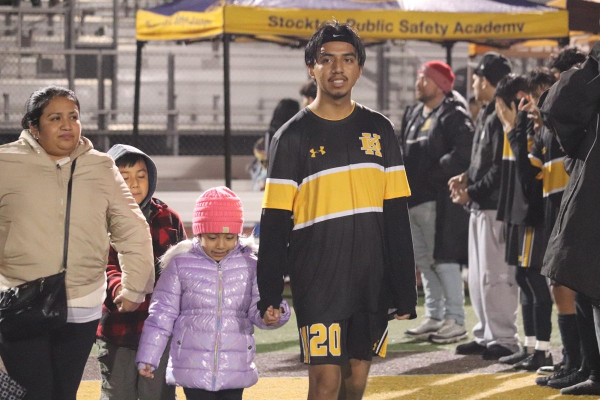 Miguel Garcia walks with his parents and siblings, celebrating completing his senior year of soccer. Garcia plays on the wing both left and right.