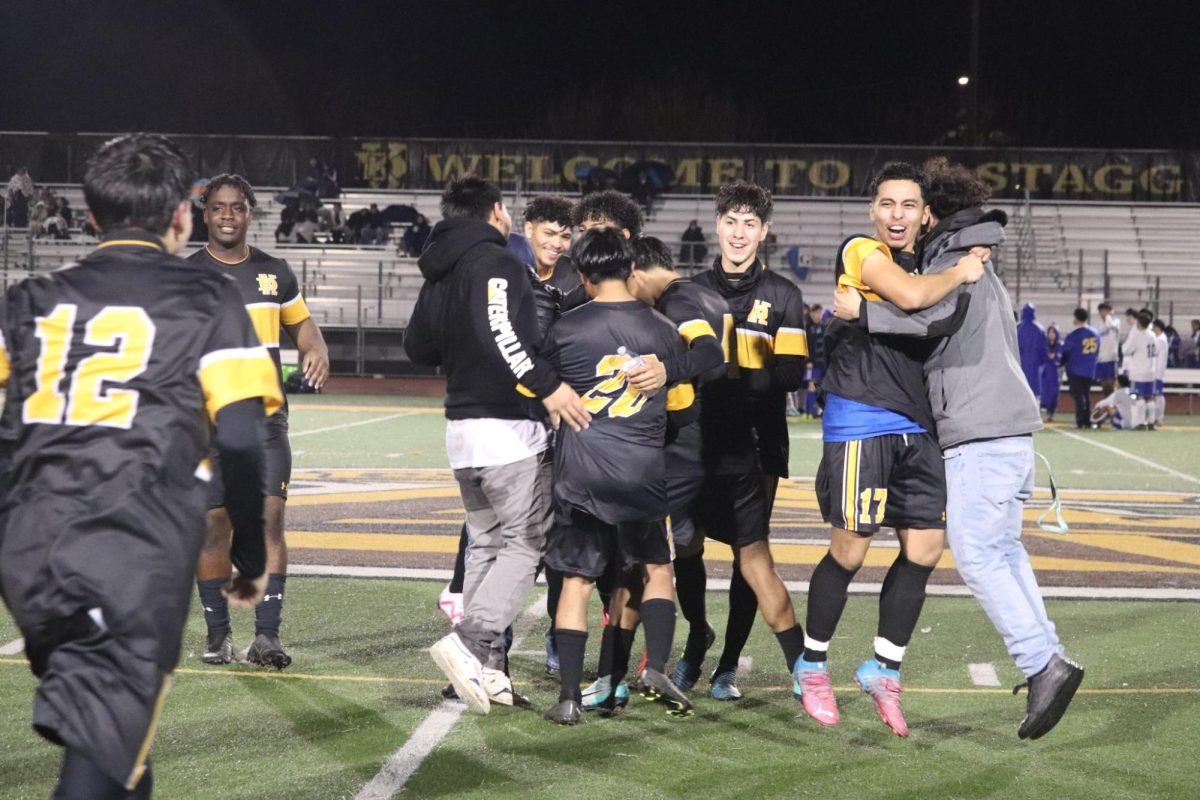 As the senior night ended, friends and teammates ran to greet and congratulate. The team hypes up again before starting their half time game against Linden.
