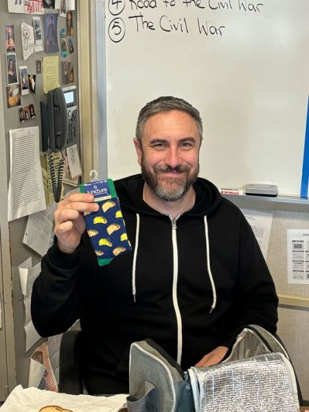 “Rothrock shows off a pair of taco socks he got as a gift during lunch by one of his students. He ended up wearing these pairs of socks the following day.
