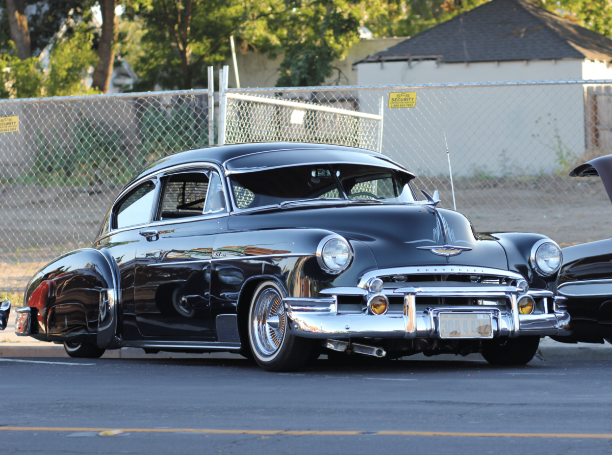 A Black Buick Super kicking back on the side of the road. The driver of this vehicle had a couple of buddies join him during the event.