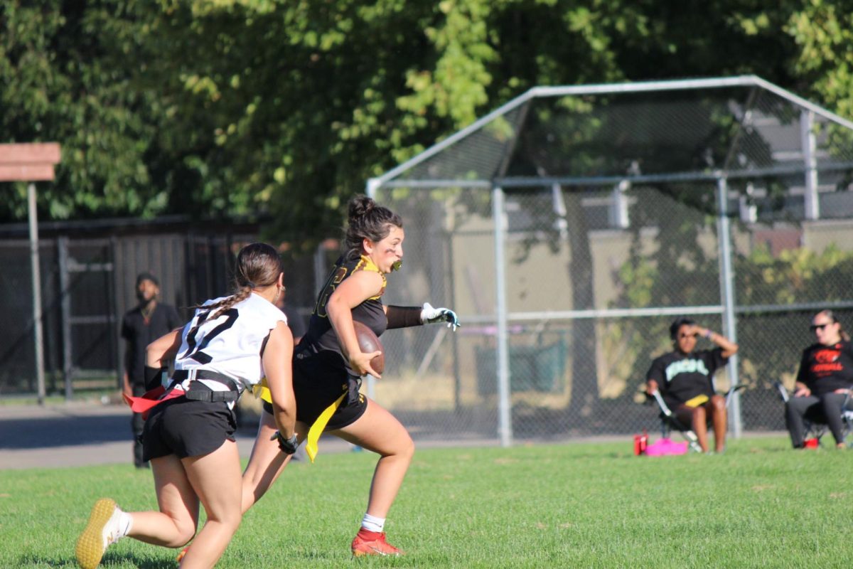 Senior Delliah Raley runs for the touchdown while evading the opposing team. Raley has 9.0 Yards Per Game (YPG)