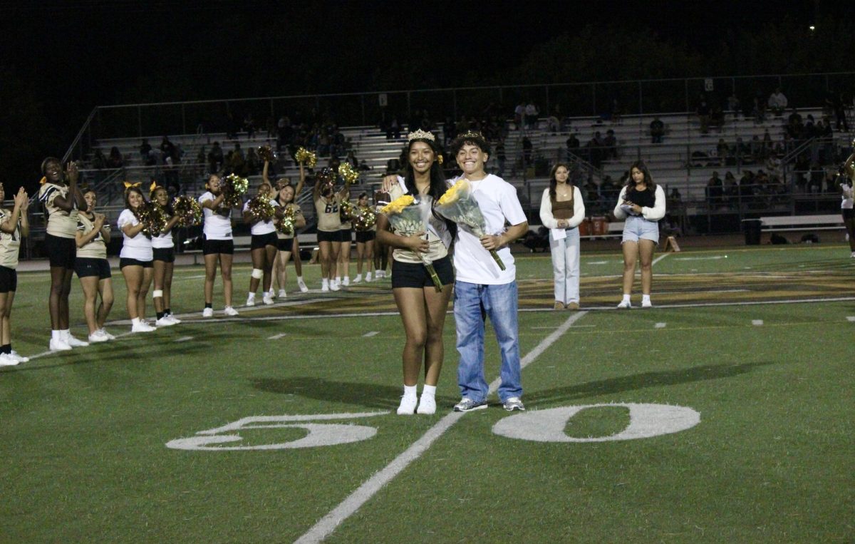 Homecoming King and Queen Adalina Pineda and Sebastian Ramirez pose for a picture after being crowned by the previous year's king and queen. The last years prom king and queen were Jameelah Pharms and Luis Nolasco.