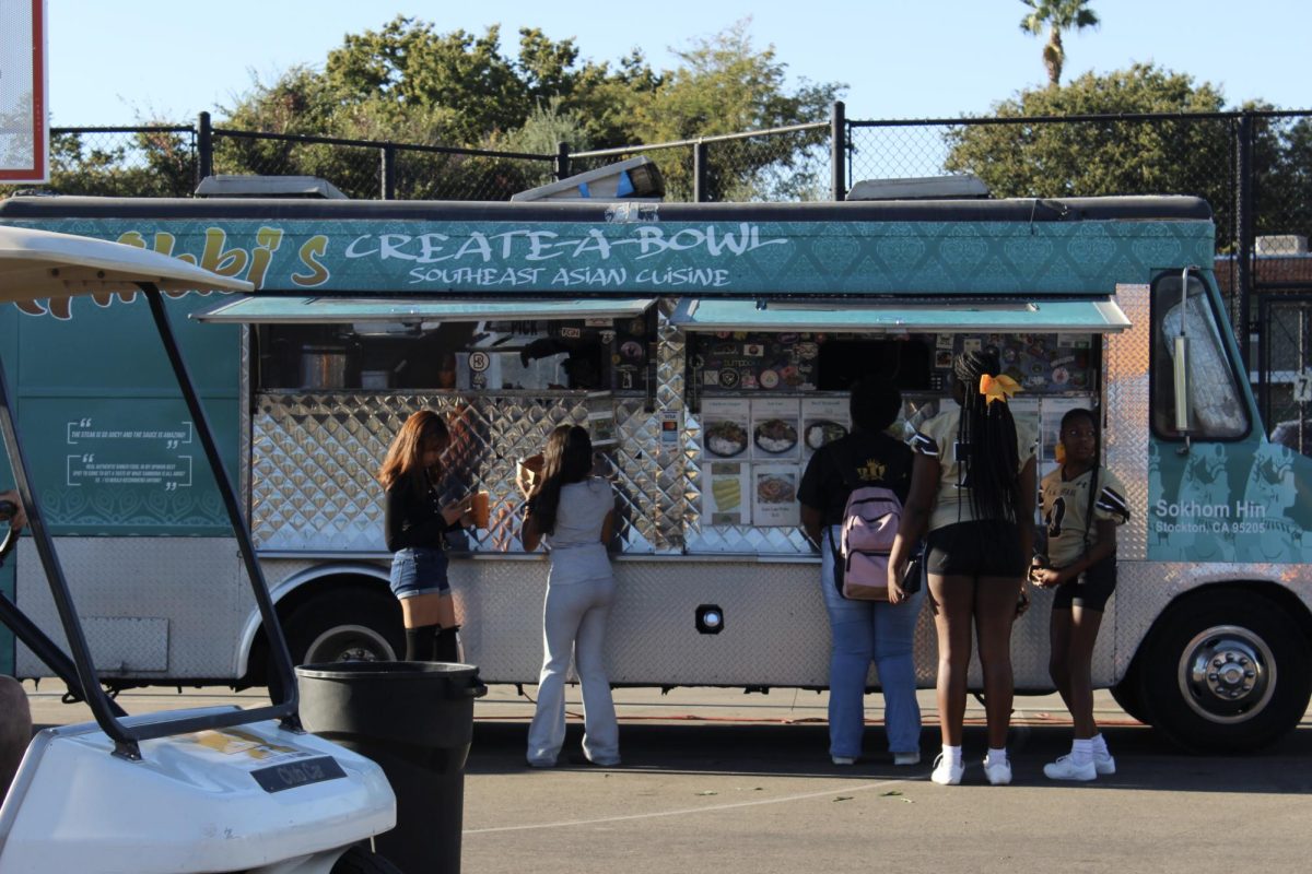 Stagg supporters line up for food at the Homecoming tailgate. There were 3 food trucks, as well as face painting and games. 