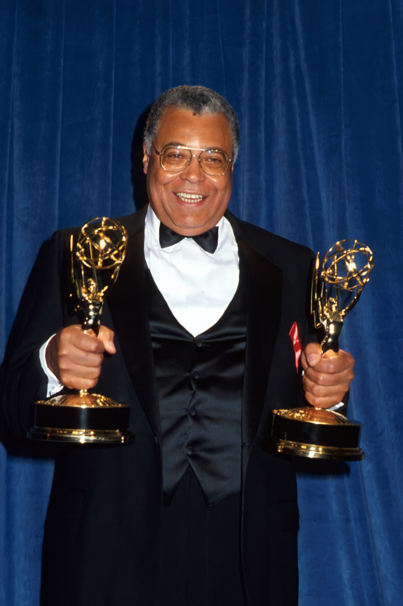 A picture from official Emmy.com displays James Earl Jones happily holding his two Emmy awards. The awards were  for Outstanding Supporting Actor in Heat Wave
 and for Outstanding Lead Actor in a Drama Series for Gabriel’s Fire.- 