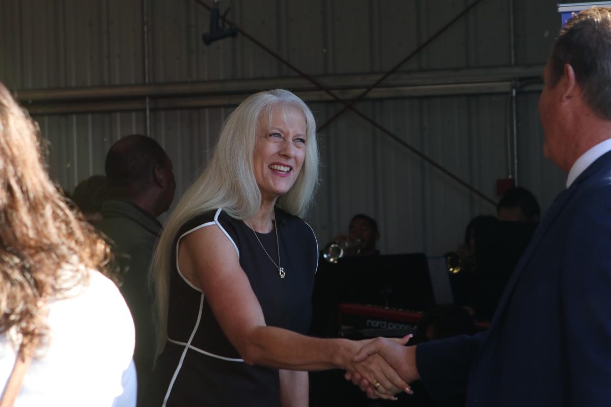 ¨Superintendent Dr.Michelle Rodriguez shakes hands with attendee. She played a big part in making the event come to life.¨