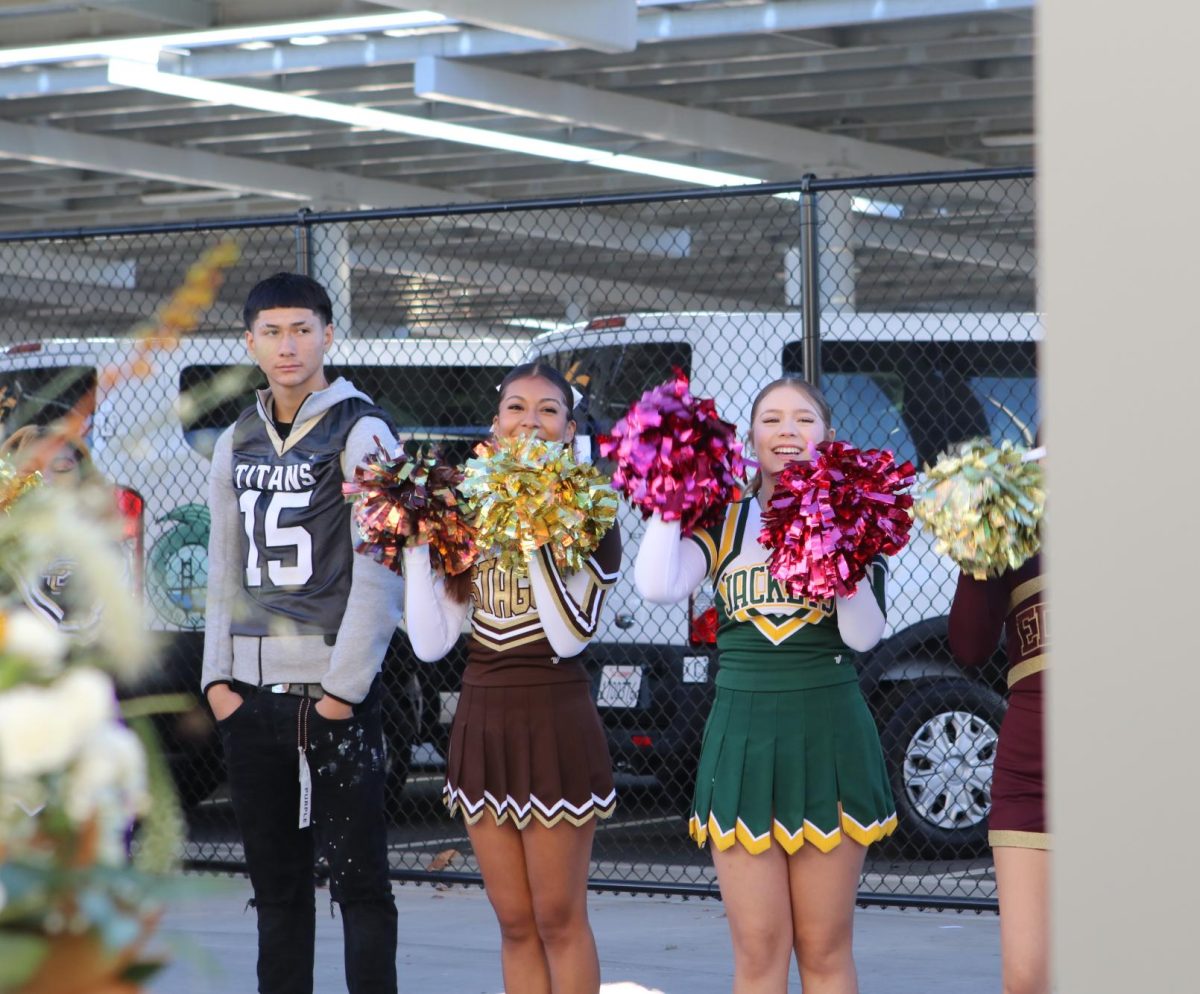 Cheerleaders and athletes from Chavez, Stagg and Franklin cheer along the walkway to the barn. They shared a warm welcome to the many people that attended the event.