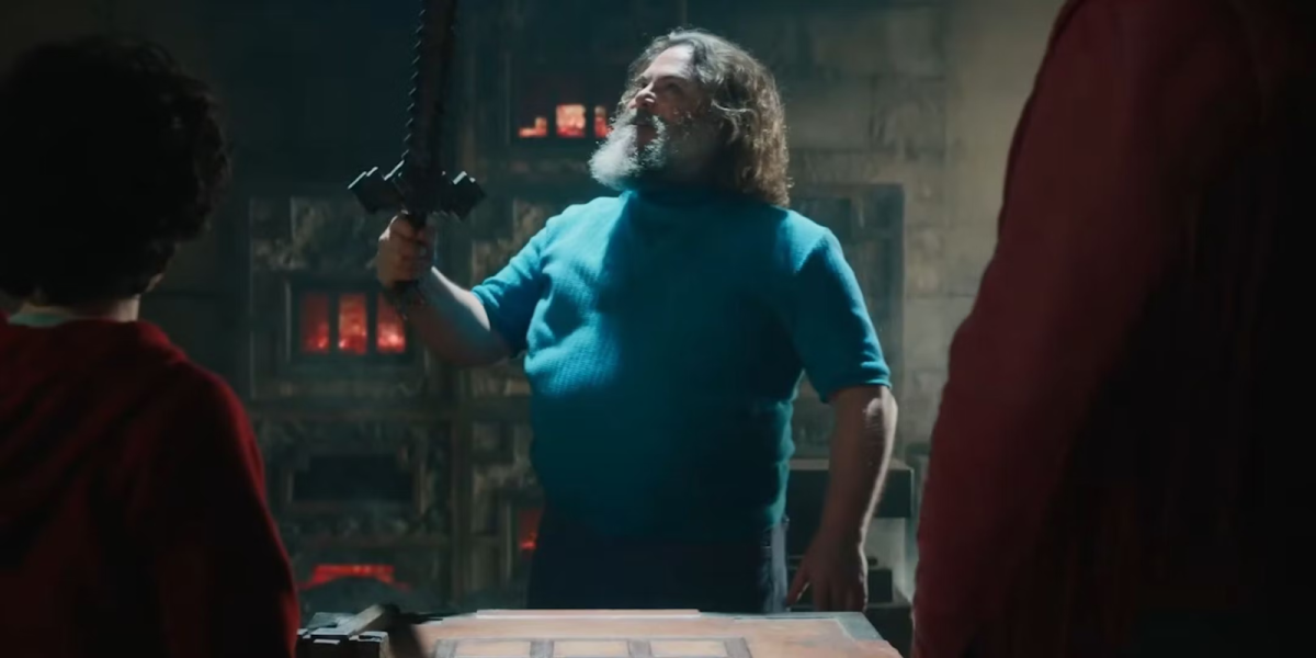 Steve (Jack Black) holding an iron sword made in a crafting table, from Warner Bros. 
