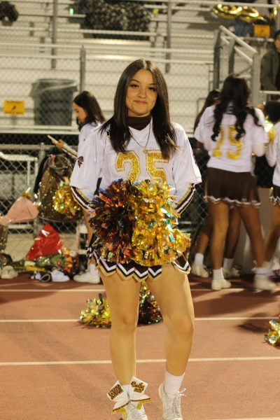 Senior Emily Valencia on her senior night during the last football game of the season. Valencia has been a cheerleader for two years. She is also the owner of ‘Emily’s Cookies’.