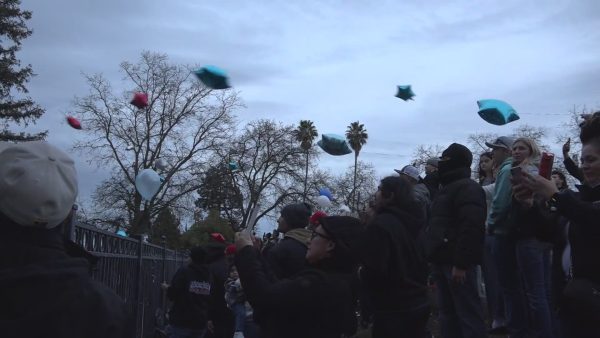 Family and friends release red and blue colored balloons to commemorate the life of Julian Martinez. The vigil was held on February 3rd at Anderson Park.