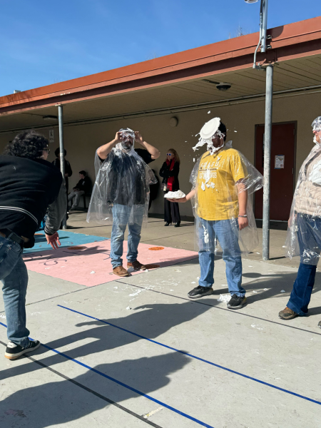 Junior Ruben Manabat finds his mark hitting Ag Teacher Damien Arceo in the face with a pie. Ruben had hit all five Ag.Teachers and three FFA officers.