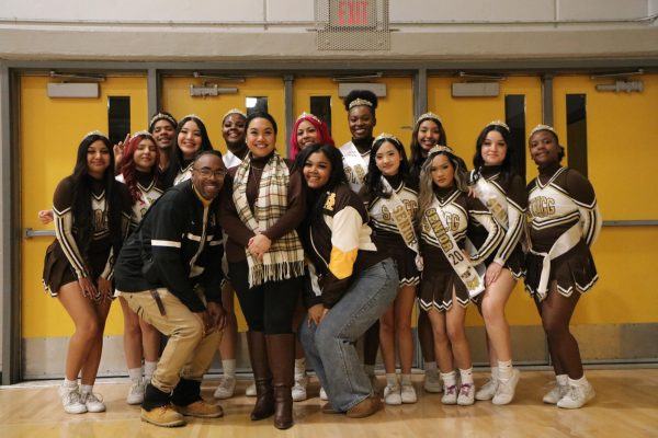 Varsity Seniors gather around their coaches before their announcements begin. From left, Coach Knott, Coach Railubin-Trejo and Coach Imani pose in the front of their seniors. 