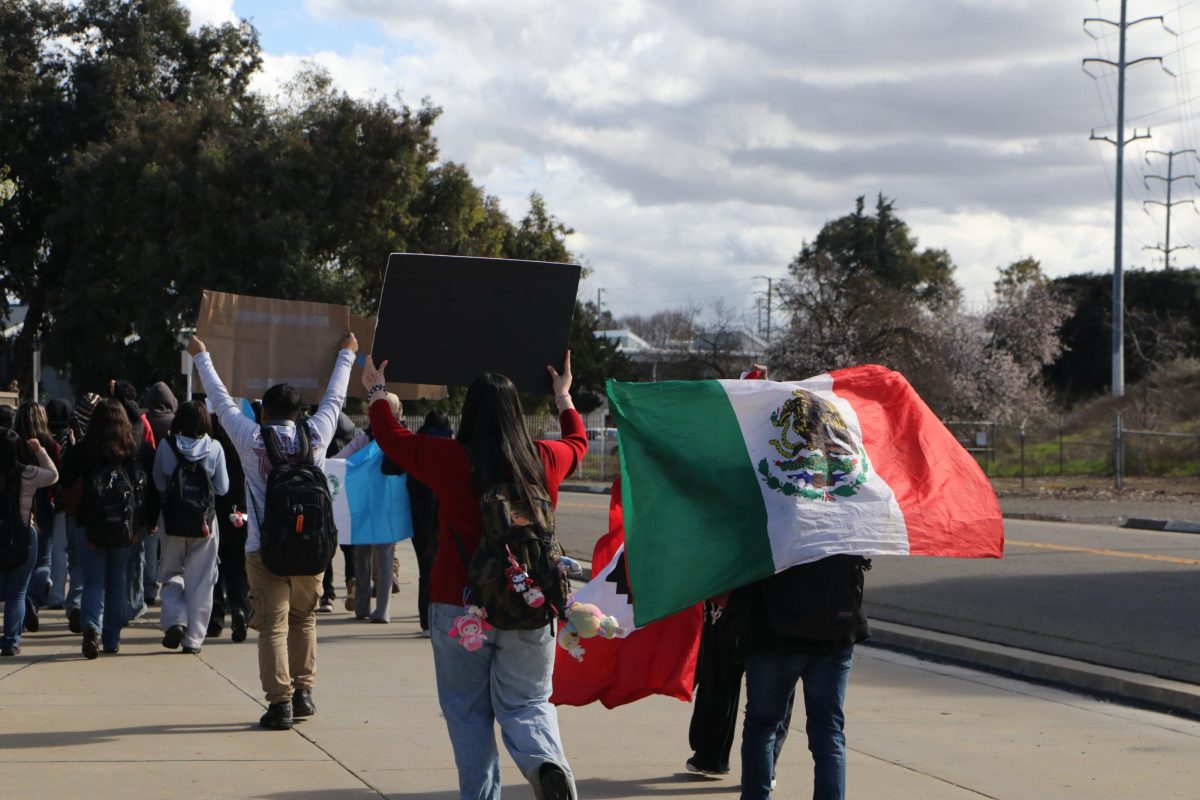 Stagg students walked out of class to their planned destination at the bus stop on N. Pershing holding their signs and flags high. Students from Kohl Elementary school, located on the route to the bus stop, yelled out in support of the protesters. 