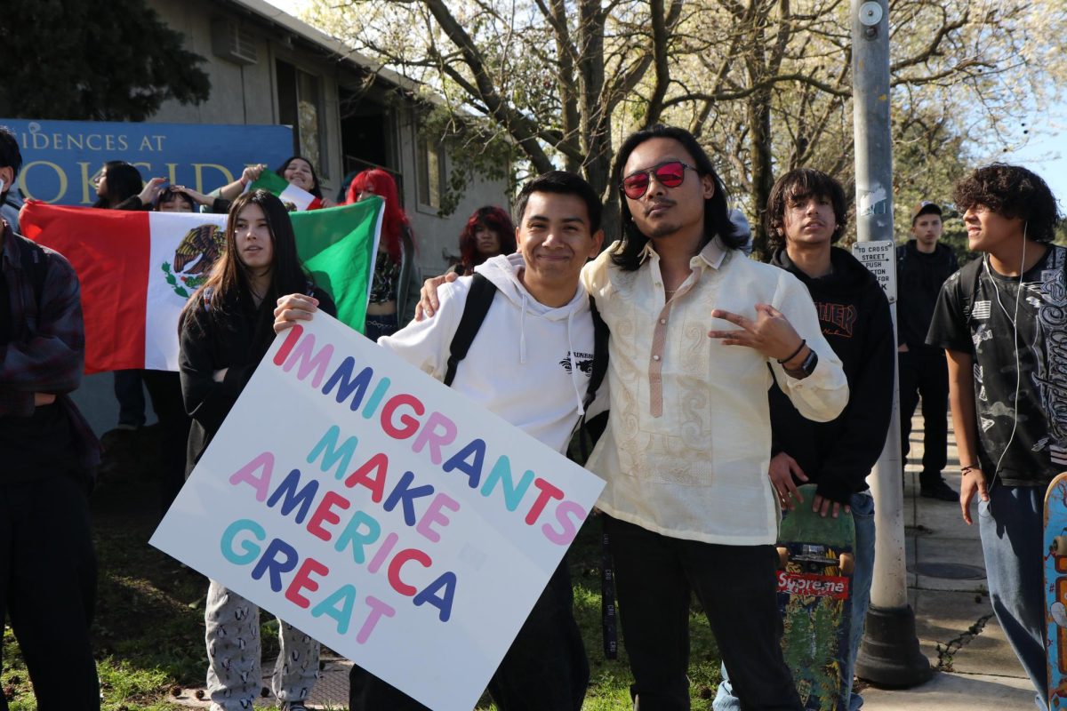 12th grader Ramiro Barajas Silva with English teacher James Medrano during the protest.